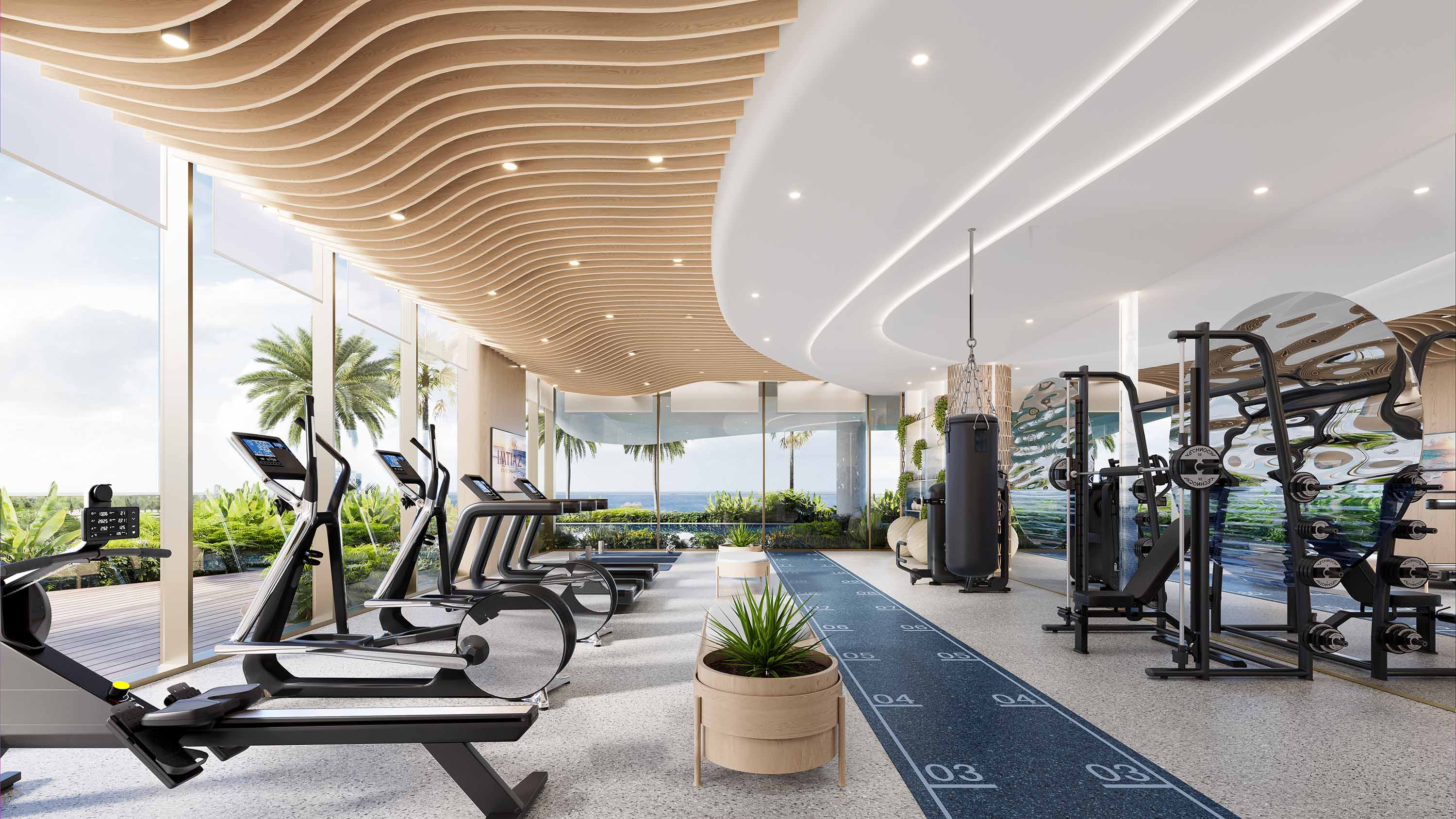 Sunset Bay By Imtiaz Modern gym interior with fitness equipment, large windows showcasing greenery, and an elegant wooden ceiling.